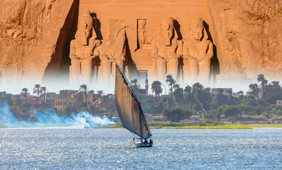 Beautiful Nile scenery with sailboat in the Nile on the way to The Front of the Abu Simbel Temple -...
