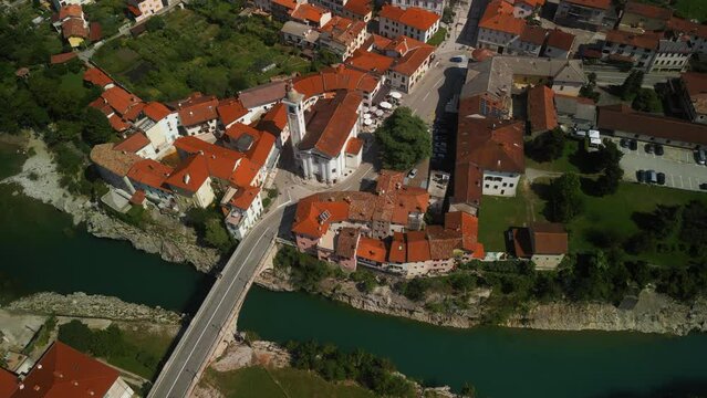 Aerial footage of the city of Kanal ob Soci, Most Kanal Bridge and Soca River in Slovenia