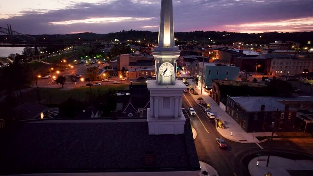 Drone shot of Second Baptist Church with Sherman Minton Bridge in the background at sunset, USA