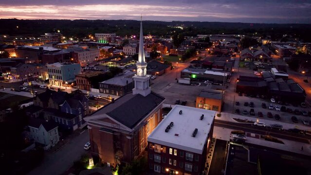 Drone shot over the historic Second Baptist Church (Town Clock Church) at sunset in New Albany, USA