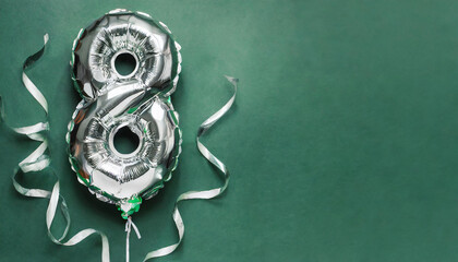 Banner with number 8 silver foil balloon. Eight years anniversary celebration. Green background.