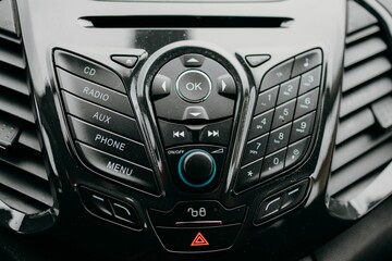 Interior view of a car featuring the dashboard, air vent and thermostat controls