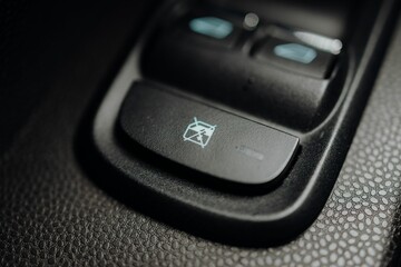 Fototapeta premium Closeup shot of a car button that stops the car's windows from opening