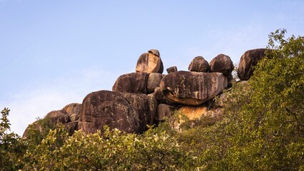 Rocks in Arcadia on Magnetic Island in Townsville, Australia surrounded by trees - obrazy, fototapety, plakaty