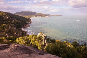 Aerial view of a beautiful sunset over Nelly Bay near Hawkings Point on Magnetic Island - obrazy, fototapety, plakaty
