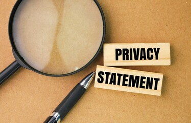 magnifying glass, pen and stick with letters or words privacy statement. the concept of privacy
