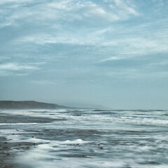 Beautiful view of a scenic seascape with white and foamy waves, Isle of Wight