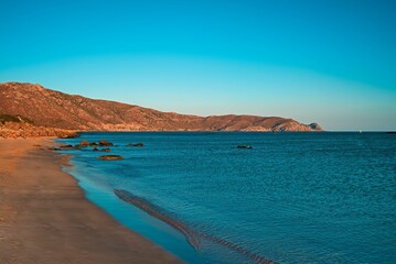 Tranquil beach scene in the evening during the sunset in Elafonissi Beach, Crete, Greece