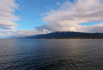Stunning and peaceful scene of the Beagle channel with hills in the background