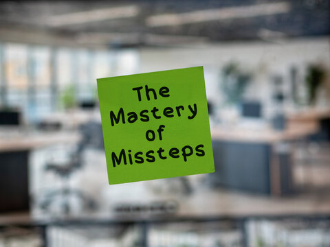 Post note on glass with 'The Mastery of Missteps'.