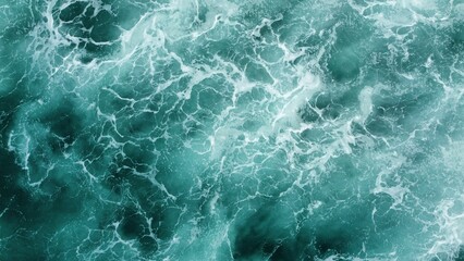 Aerial shot of crashing waves in the ocean