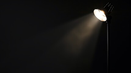 Spotlight illuminating the empty space on a dark background.