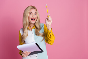 Photo of charming gorgeous clever woman hold pencil rejoice find brilliant solution empty space...