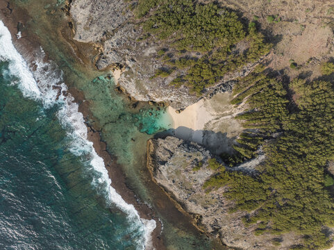 Aerial view of Trou d'Argent beach and turquoise lagoon, Rodrigues Island, Mauritius.