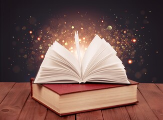 Open old Book With magic Glowing light