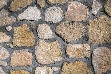 House wall made of natural stones and shell rock as background 1