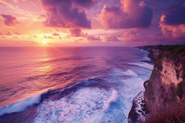 The dramatic and picturesque scenery of a cliffside ocean view at sunset, with vibrant colors and a sense of grandeur.