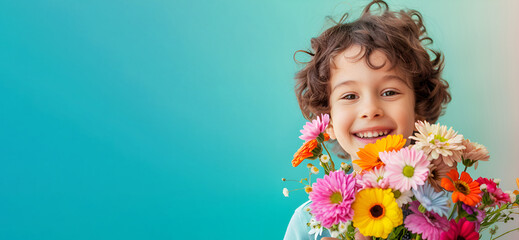Little boy with a bouquet of flowers on a blue background