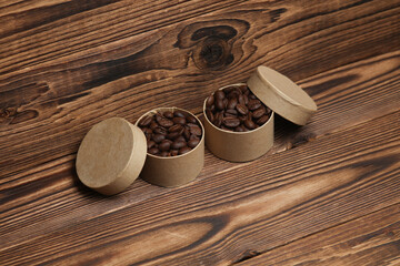 Coffee beans in boxes on a wooden background