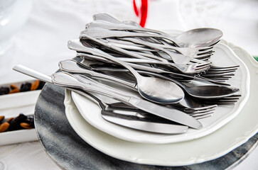 a set of silver cutlery knives, forks and spoons for the holidays