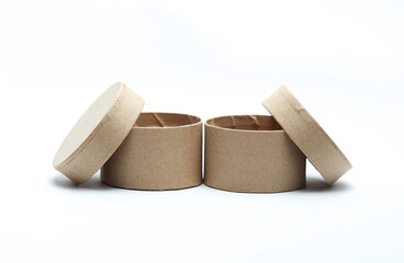 Round craft cardboard box for product on white background