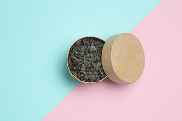 Green tea in box on pink blue background