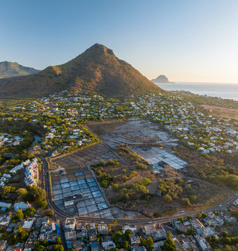 Aerial view of Tamarin beach with La Tourelle and Le Rempart mountains, Riviere Noire, Mauritius.