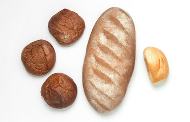 Bread and buns on a white background. Bakery. Top view