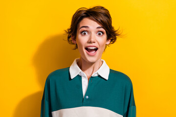Photo of pretty nice young girl open mouth cant believe wear shirt isolated on yellow color background - obrazy, fototapety, plakaty
