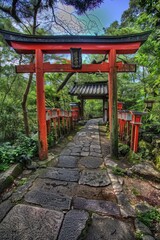 A red gate with a stone walkway leading to a building