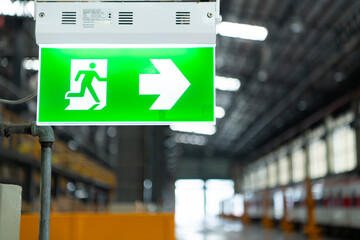 Emergency exit sign on the platform of the railway repair station.