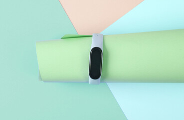 Creative layout of a modern smart bracelet on a pastel background