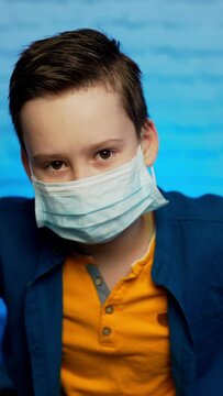 boy wearing medical mask protection coronavirus COVID-19 or dust pm2.5 thumbs up safety healthy self air pollution concept Vertical video