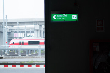 Emergency exit sign on the platform of the railway repair station.