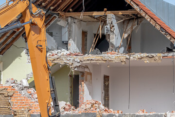 Demolition site with a house  being destroyed