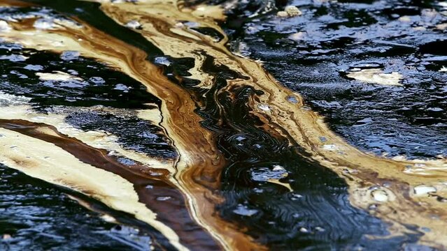 Closeup Oil spill texture on sea surface Environmental disaster and Marine pollution concept HD 4K