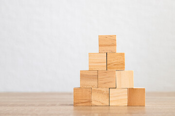 Wooden block pyramid on a clean background