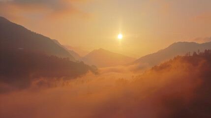 Fototapeta premium Sunrise Over Misty Mountain Valleys - peaceful nature - The sun rises, casting a golden glow over the mist-enshrouded valleys nestled between the mountain peaks.