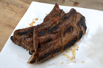 Liempo, grilled pork belly, one of the traditional food that can be found in Filipino restaurant, Taguig, Philippines.