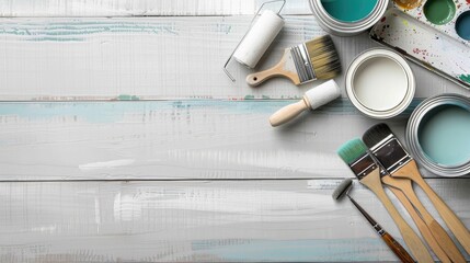 a paint can, paintbrush, and roller arranged neatly on a pristine white wooden background, offering ample copy space for your text, perfect for showcasing a painting tools set.