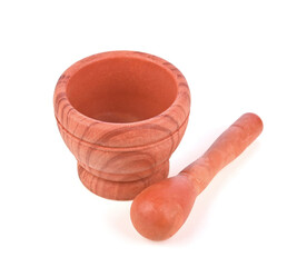 Wooden pattern mortar with pestle on white background.