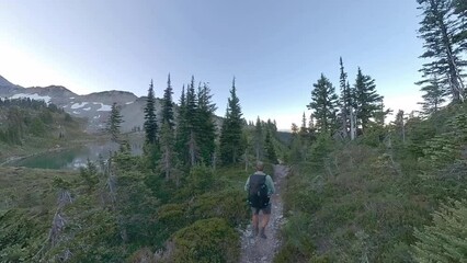 Man Hikes Along Saint Andrews Lake on Wonderland Trail in Mount Rainier