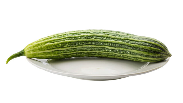 Snake gourd over on a plate isolated on Transparent background.