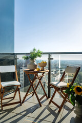 Obraz premium Vertical shot of outdoor balcony with cityscape of the urban residence.