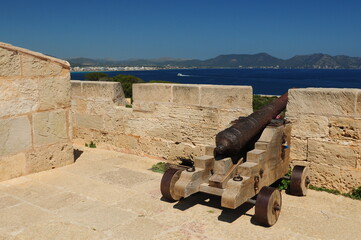 Cannon On Top Of The Fortress Castell De La Punta De N'Amer Sant Llorenc Mallorca On A Wonderful Sunny Spring Day With A Clear Blue Sky