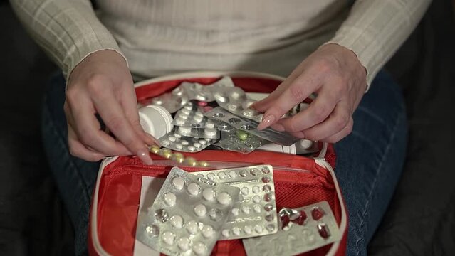 medicines and first aid kit. look for medical pills. Slow motion video. High quality video in 4K format.