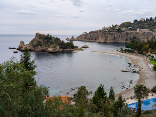 Panoramic view of beautiful Isola Bella, small island near Taormina, Sicily, Italy. Narrow path...