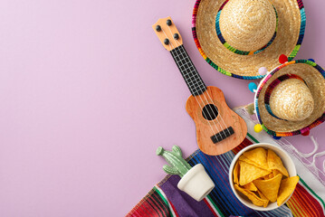 Cinco de Mayo concept. Top view picture featuring characteristic gear: sombreros, stringed vihuela,...