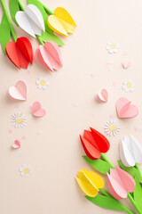 Lovingly handmade for Mom: Overhead vertical perspective of beautifully crafted paper tulips, chamomiles, alongside heart cutouts on a pastel canvas, with space for inscribing message or advertisement