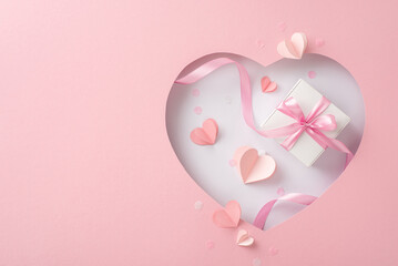 Chic Mother's Day concept, top view: a silk-bowed present, heart-cut paper, and trendy confetti peeking through a heart cutout on a pastel pink base, blank space for words